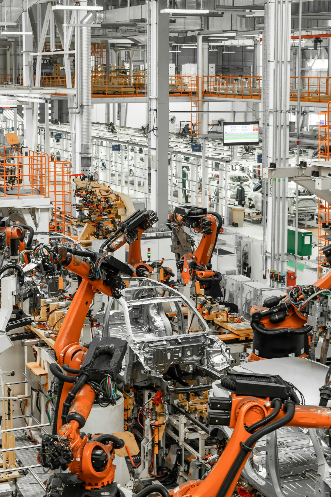 Robot arms working a body-in-white assembly line