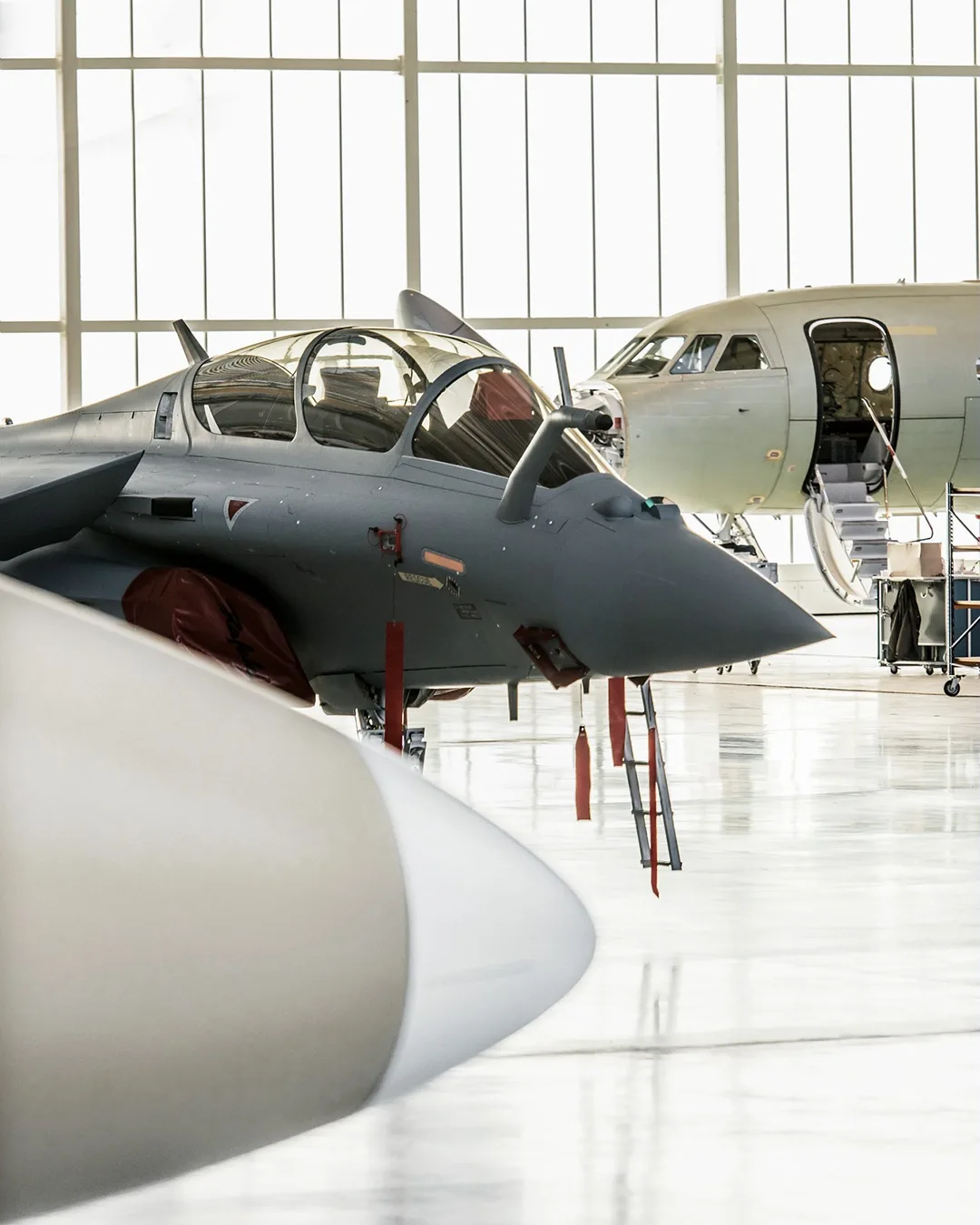 Military aircraft in a maintenance hangar