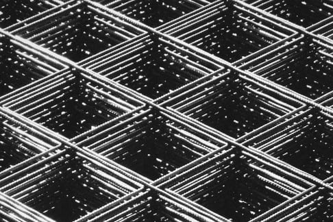 Stacked sheets of welded steel reinforcing mesh